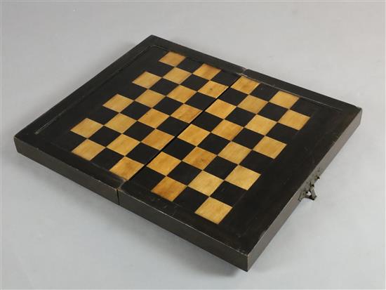 An early 19th century ebony and boxwood travelling games box, 23 x 13.5in.